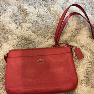 Reddish pink coach shoulder bag